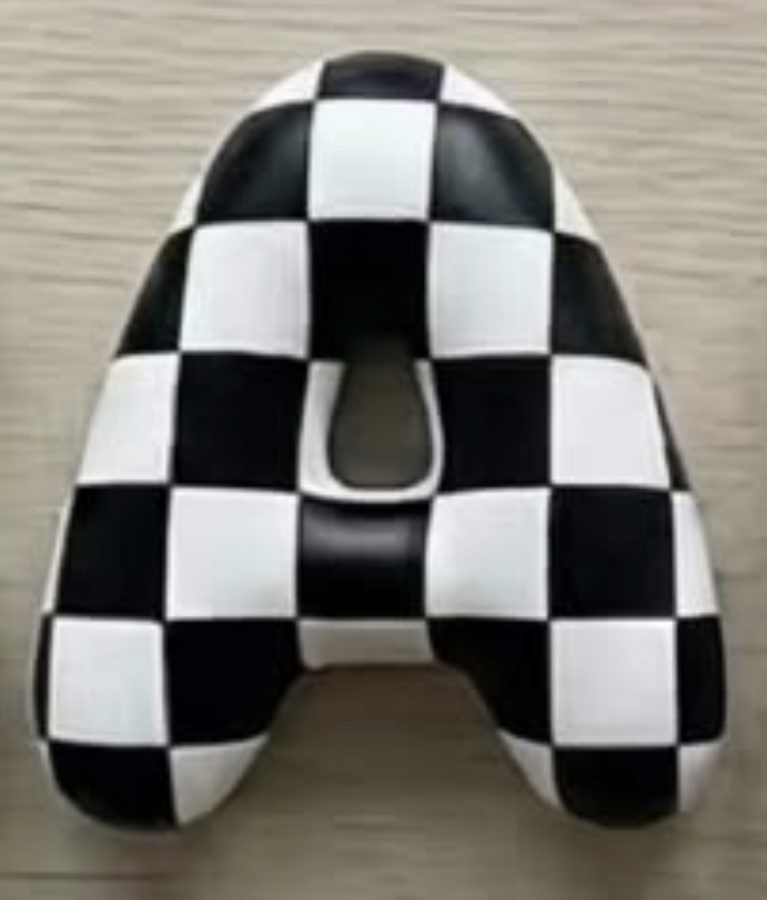 Black and white checkerboard letter