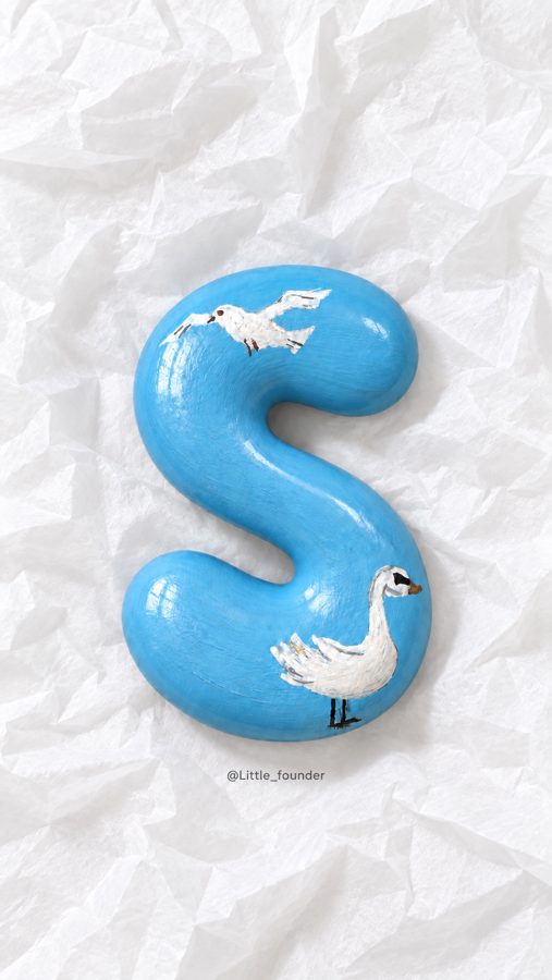 Blue letter S with swans